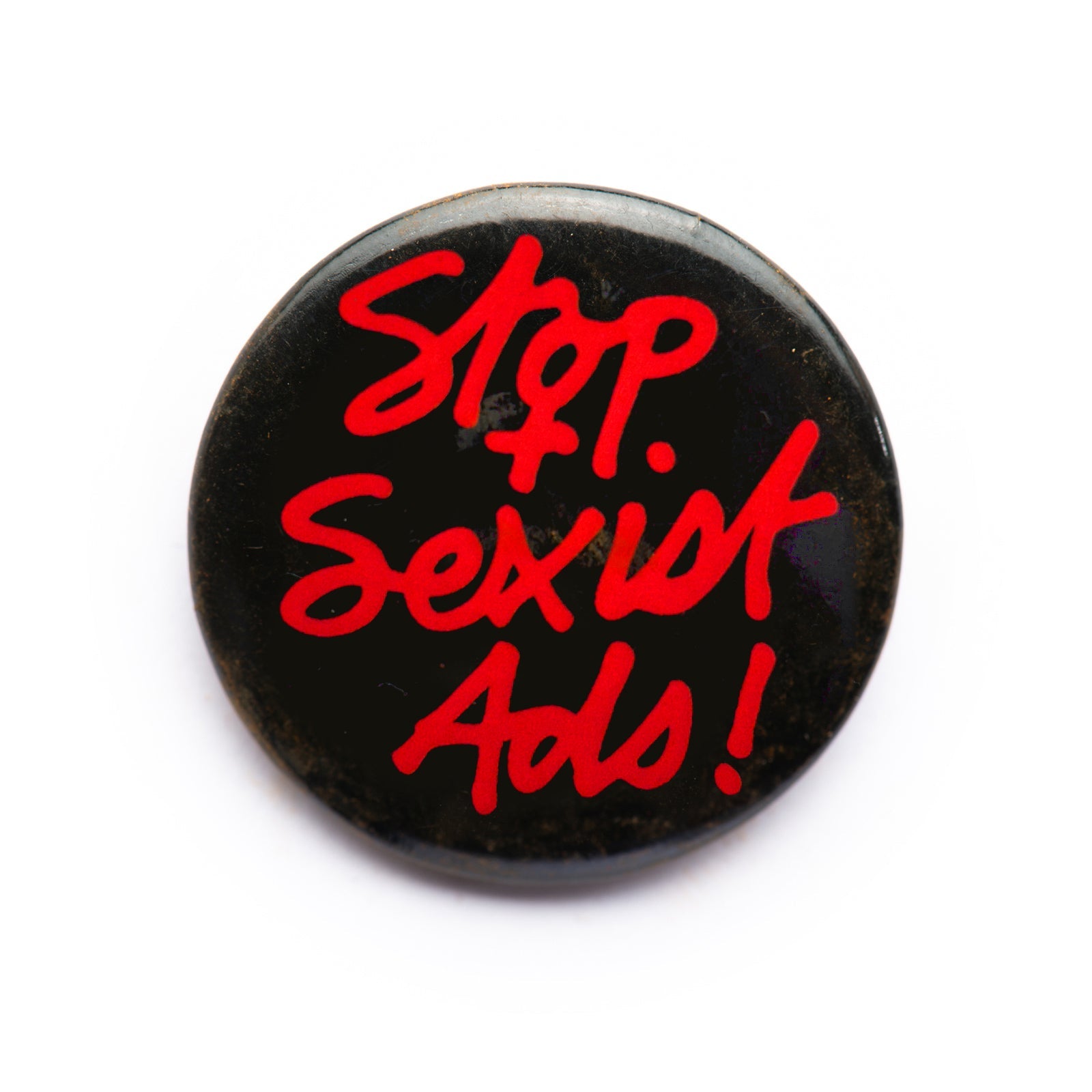 "Stop Sexist Ads!" button pin - RADICAL MEDIA ARCHIVE