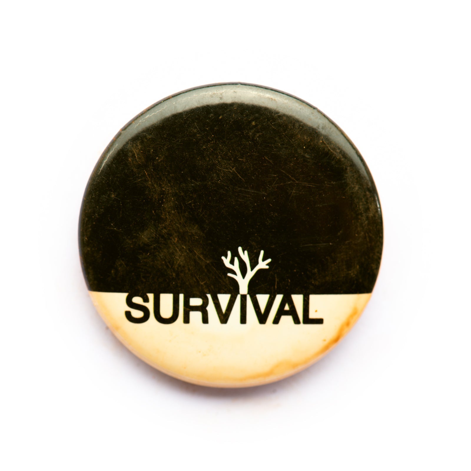 "Survival" button pin - RADICAL MEDIA ARCHIVE